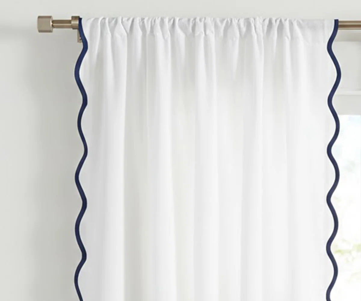 White scalloped curtain panel with navy blue trim