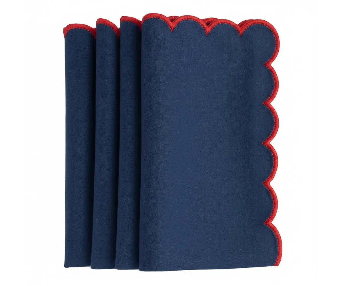 Reusable scalloped table napkins with refined red trim detailing
