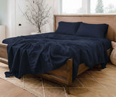 European Linen Sheet Set crafted from breathable 100%  pure soft bed linen for year-round, natural linen navy blue sheets layered with pillows