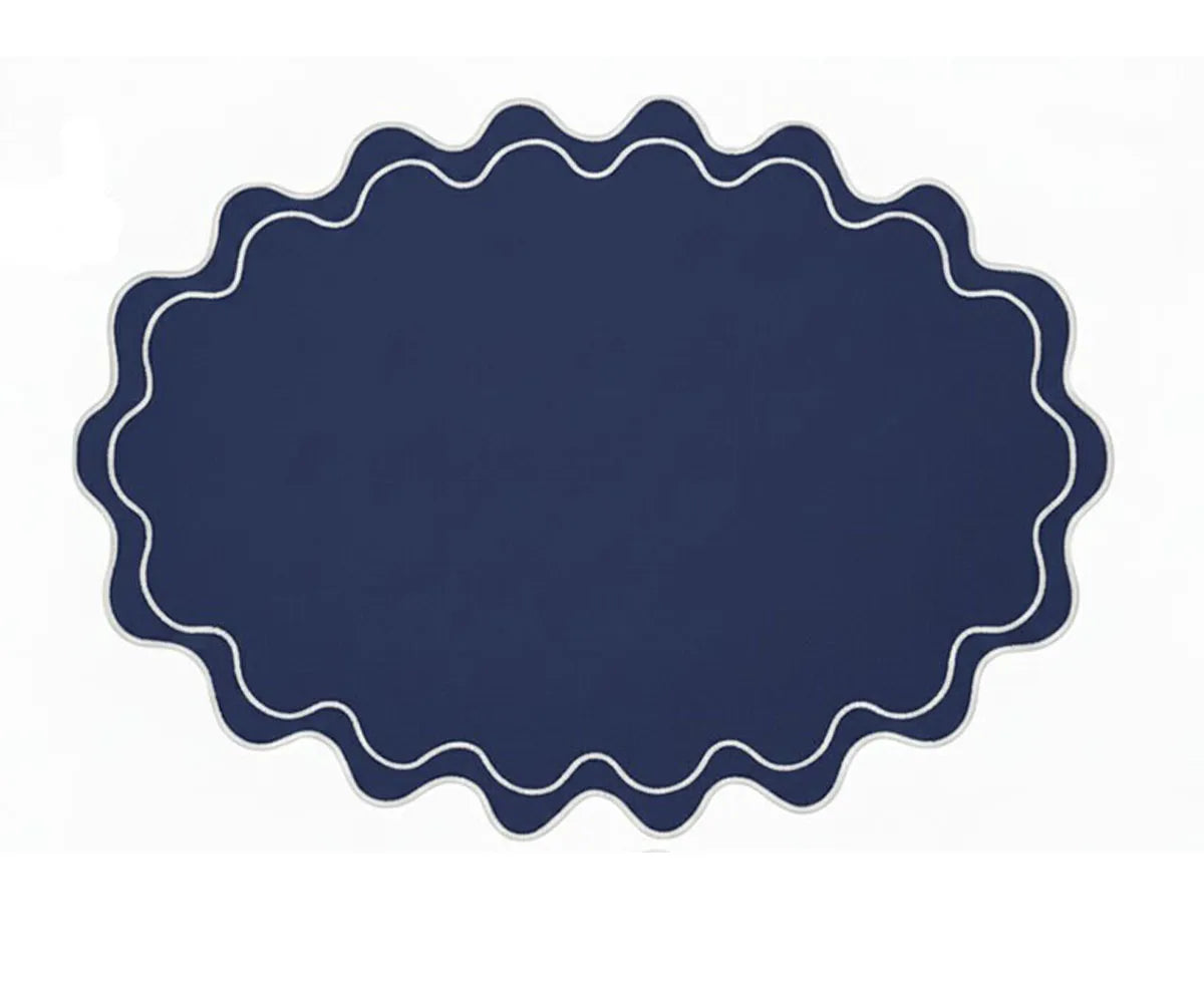 Washable cotton oval placemat with a refined scalloped finish, suitable for home dining and formal events