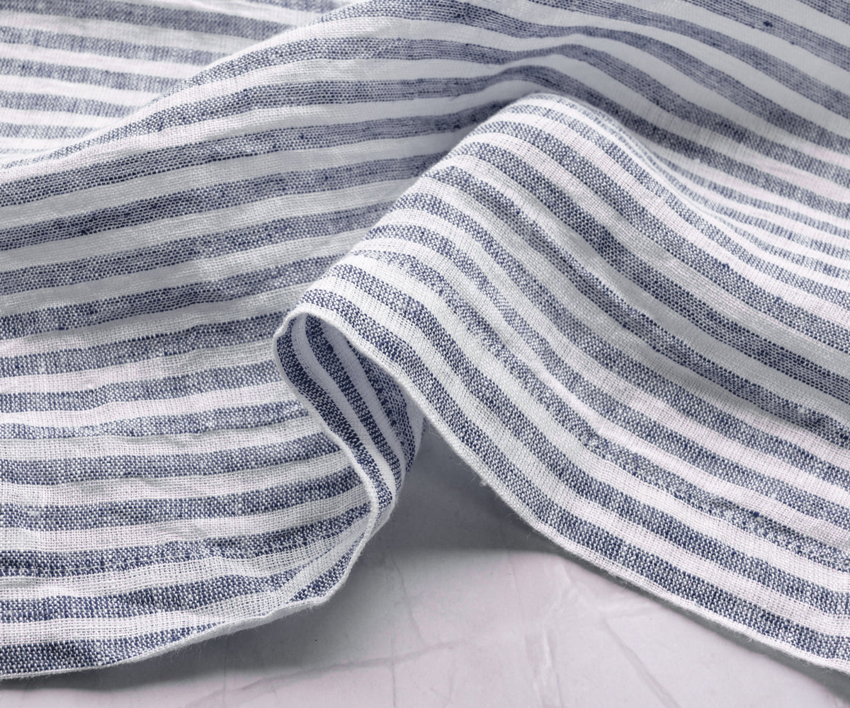 Navy blue striped napkins by All Cotton and Linen adding timeless elegance to home dining and family gatherings.