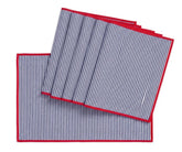 Navy blue and white striped cotton placemats with red edge trim on farmhouse dining table, washable rectangle table mats set