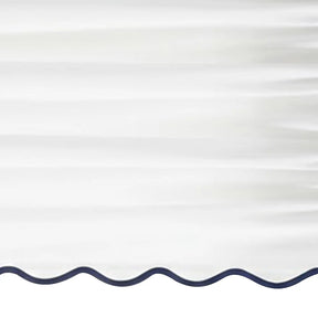 White scalloped curtain panel with navy blue trim - Close up