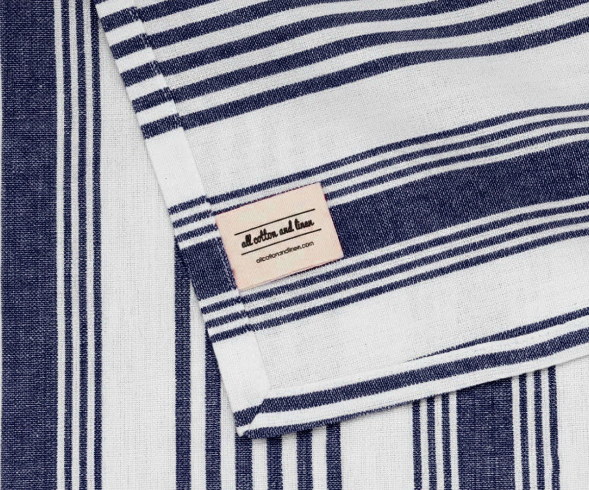 Blue striped cotton napkin with brand label
