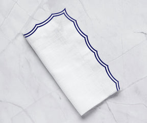 Navy cotton embroidered napkins with scalloped edges