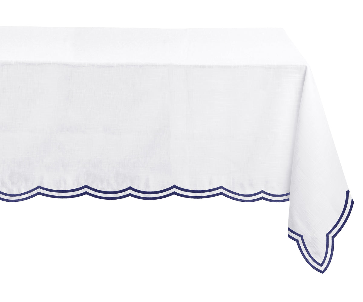 Navy blue cotton tablecloth draped over a rectangular dining table, perfect for refined gatherings