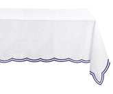 Navy blue cotton tablecloth draped over a rectangular dining table, perfect for refined gatherings