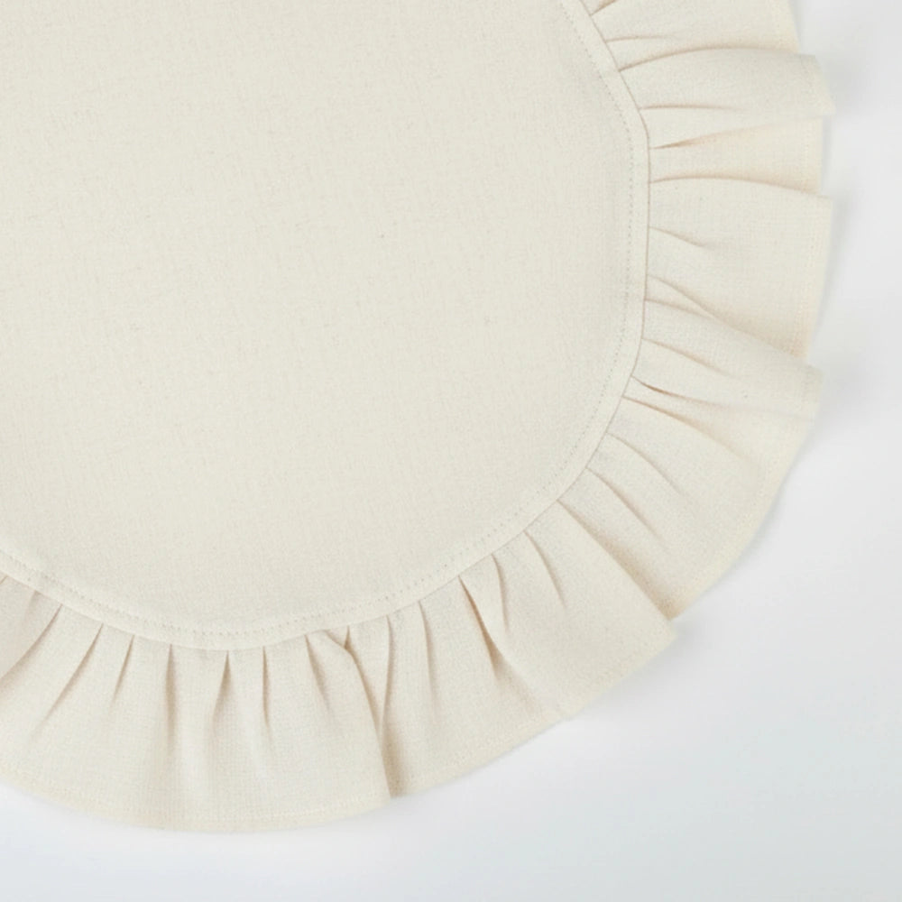 Off white round ruffled cotton napkins with a soft linen texture, perfect for neutral table settings and elegant everyday dining.