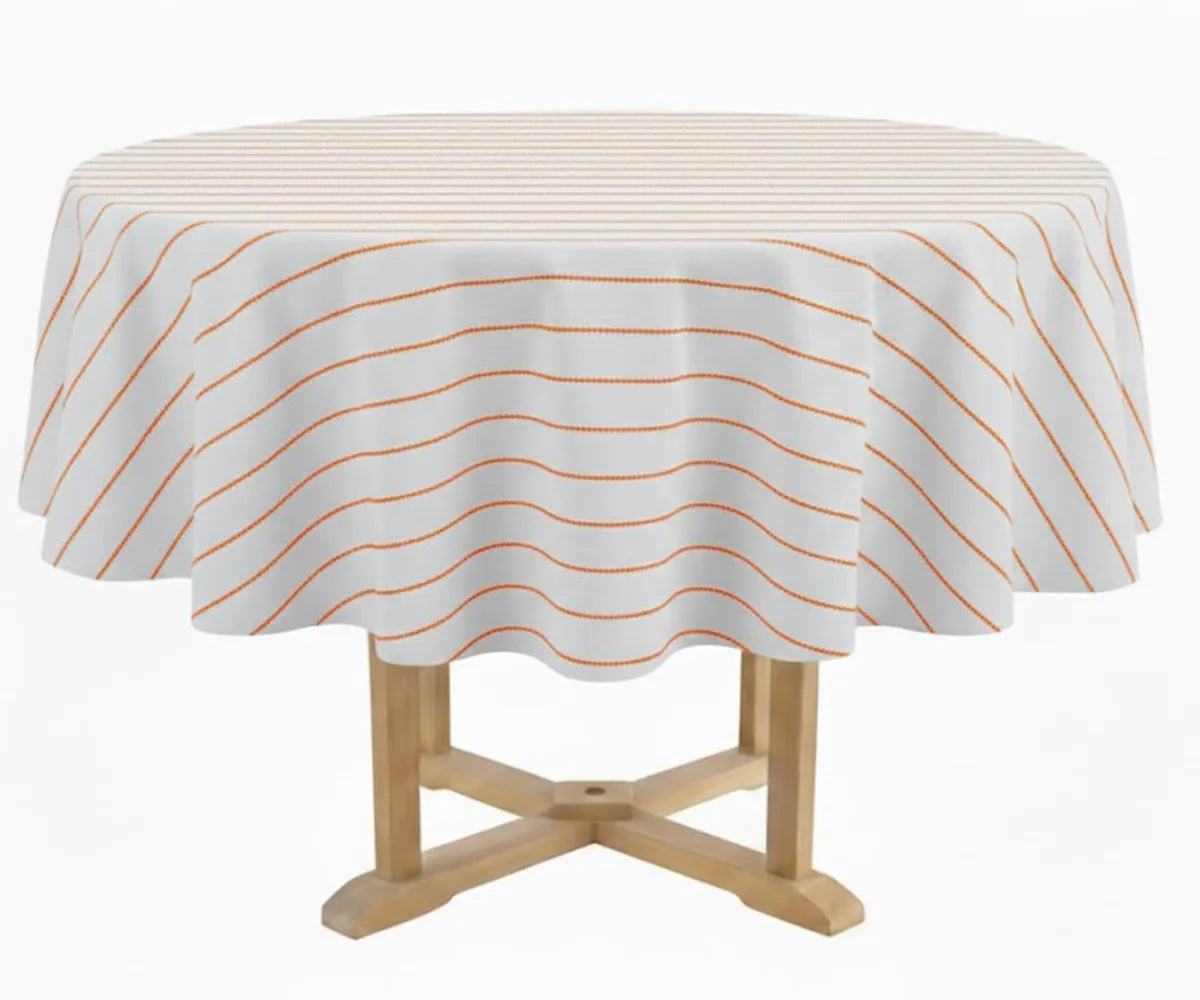Orange striped round tablecloth on a dining table made from cotton