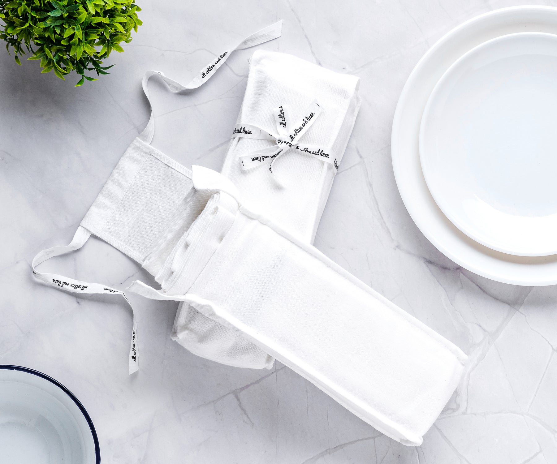 White plate and bistro napkin setup with cutlery