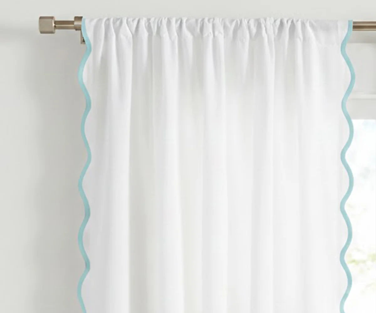 White scalloped curtain panel with light blue trim