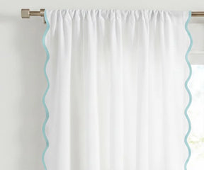 White scalloped curtain panel with light blue trim