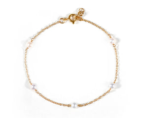 Women's pearl chain charm bracelet styled on wrist, gold pearl bracelet for everyday wear, elegant jewelry for women, birthday gift bracelet, chic pearl accessory, birthstone bracelets for women