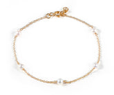 Dainty freshwater pearl chain charm bracelet worn on wrist, 4mm pearl gold bracelet for women, elegant everyday jewelry accessory