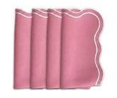 Soft peony pink scalloped cotton dinner napkins styled on an elegant wedding table with romantic peony-inspired table decor.