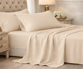 Beige cotton bedsheet set styled on a neutral bedroom bed, natural cotton bedding no chemicals