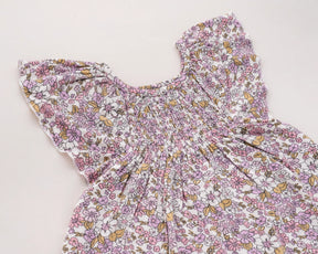Adorable pink flower print baby girl dress made from 100% cotton, featuring a sleeveless frock design perfect for parties and playtime, and a charming addition to any 100 organic cotton clothing collection.
