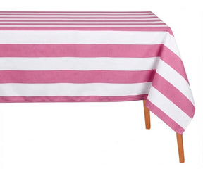 Pink and white wide cabana striped cotton linen tablecloth with straight edges draped over a dining table.