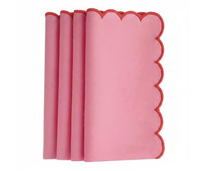 Elegant scalloped edge napkins with red trim for table styling