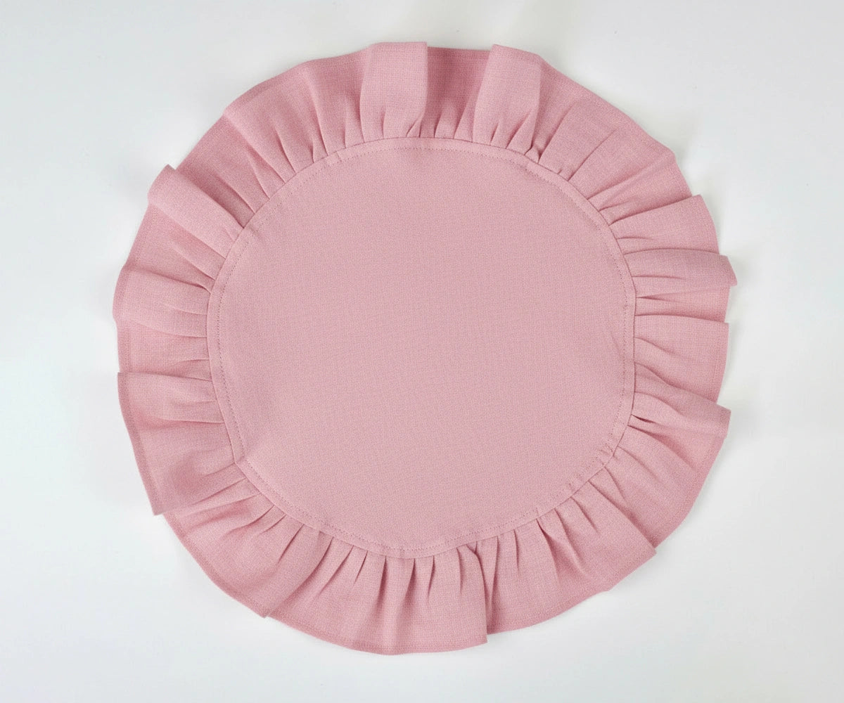 Pink round ruffled cotton napkins with soft linen texture, designed for elegant everyday dining and special table settings.