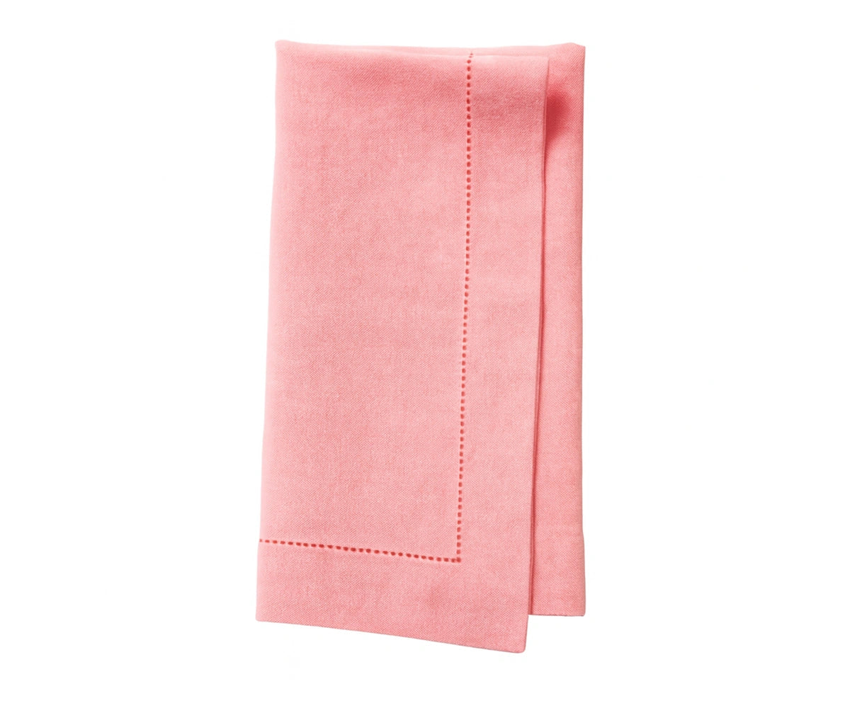 Soft light pink cotton napkin with a delicate pastel tone for elegant dining.