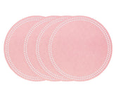 Pink round cotton placemat with embroidered dot trim on a table setup
