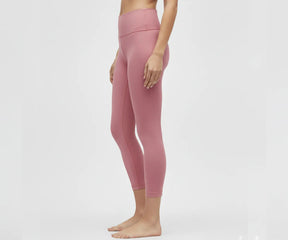 Comfortable pink leggings for women, high-rise fit with moisture-wicking, lightweight fabric ideal for workouts and everyday activities.