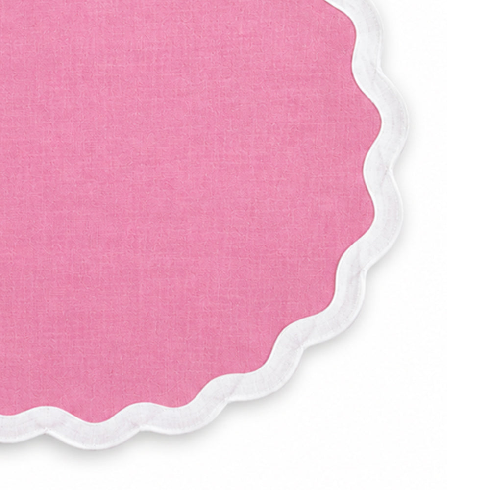 Soft pink cotton dining placemat featuring a white scalloped border, reusable table accessory