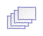 Royal blue embroidered placemats paired with matching napkins for a cohesive wedding tablescape