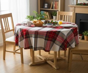 Classic red, black, and white tartan plaid round tablecloth with yellow accents, made of 100% cotton.