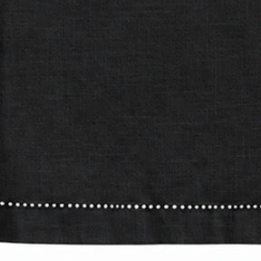 Close-up of black cotton linen tablecloth with detailed hemstitched border.