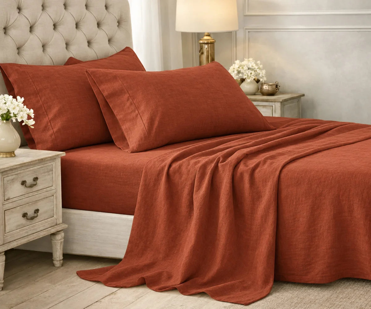 Solid terracotta plain cotton bedding set styled on a bed in an elegant bedroom.