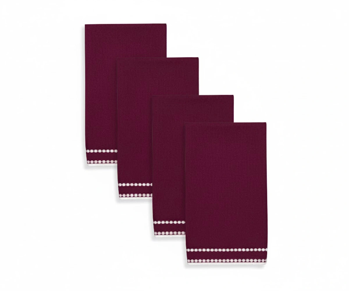 Burgundy pearl-embroidered napkin with rich pearl dot detailing for a luxurious dining setting.
