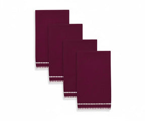 Burgundy pearl-embroidered napkin with rich pearl dot detailing for a luxurious dining setting.