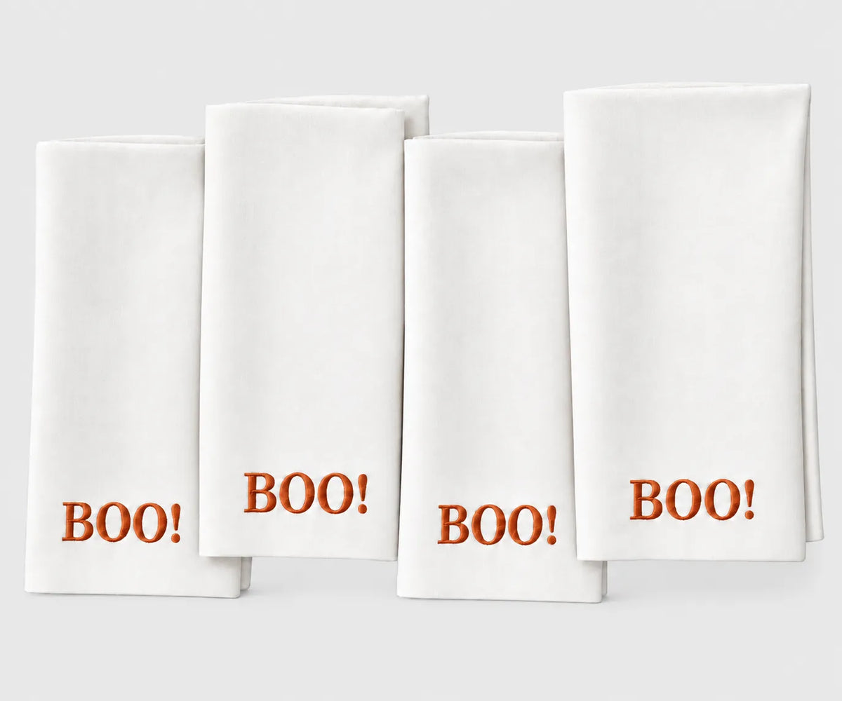 White and rust BOO Halloween cloth napkin for fall table decor and Halloween parties Reusable dinner napkin for seasonal entertaining, Halloween gatherings, autumn dining, and festive table settings.