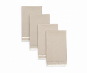 Beige napkin with soft pearl dot embroidery, offering a neutral and timeless table accent.