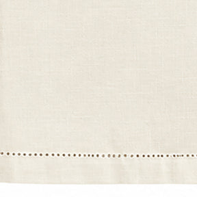 Close-up of ivory hemstitched cotton linen tablecloth fabric and border detail