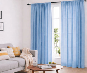 Light blue cotton curtains in living room with natural daylight