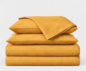 Mustard European linen bedding set crafted from 100% European flax linen, adding warm color and natural texture to bedroom décor.