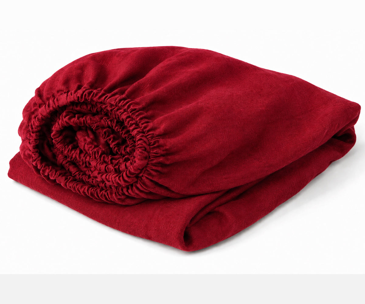 Cherry Red European linen fitted sheet made from 100% flax linen with deep pockets, breathable luxury bedding for queen, king, twin, and California king mattresses.