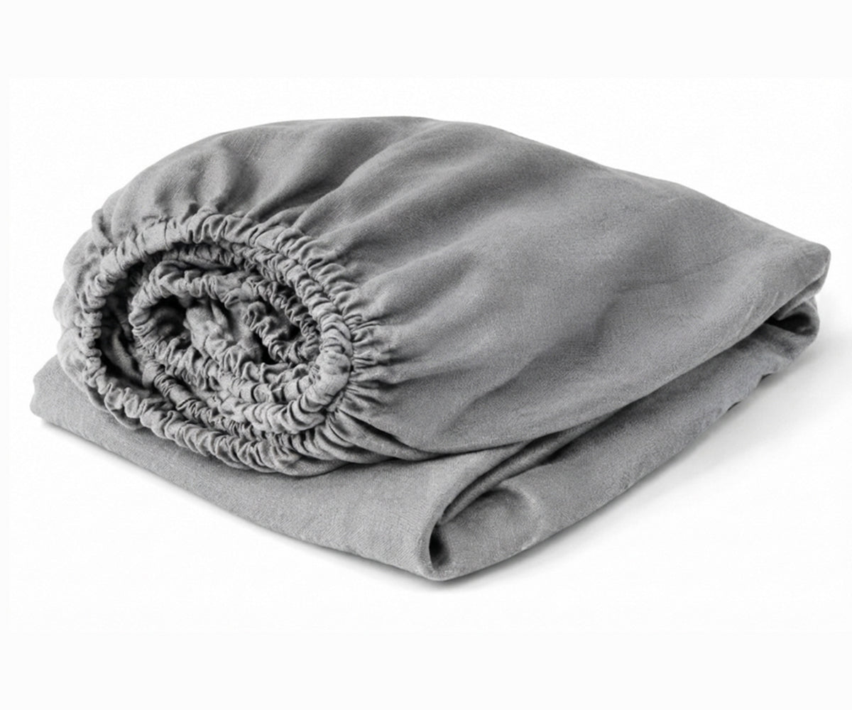 Grey European linen fitted sheet in 100% flax linen with deep pockets, moisture-wicking luxury bedding for queen, king, twin, and California king mattresses.