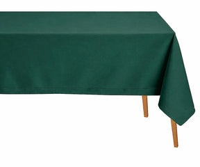Green pure linen tablecloth with refined hemstitched finish arranged on a rustic dining table for fresh botanical-inspired décor.
