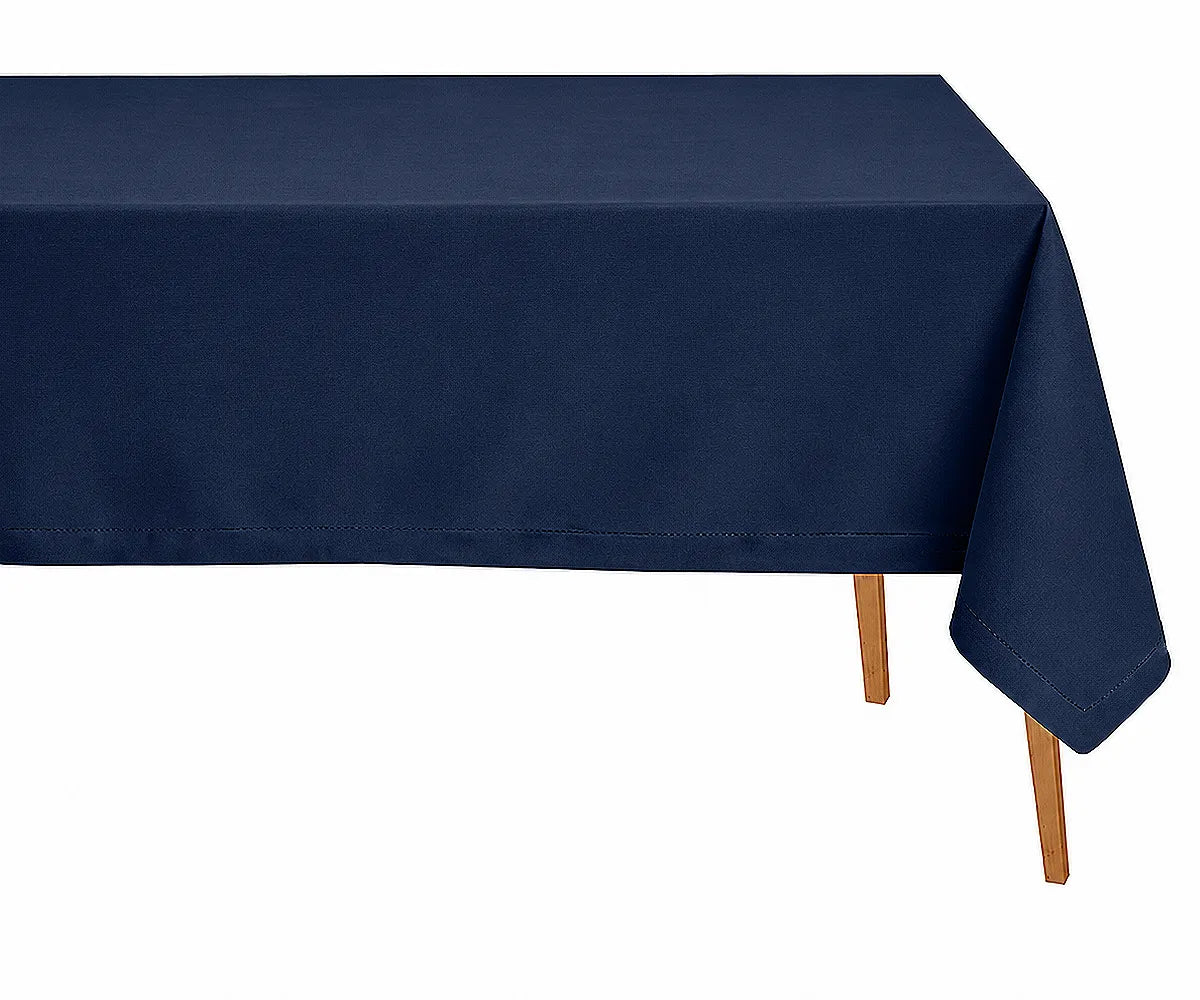 Navy blue hemstitched linen rectangle tablecloth styled on an elegant dining table for modern farmhouse décor and formal dinner gatherings.