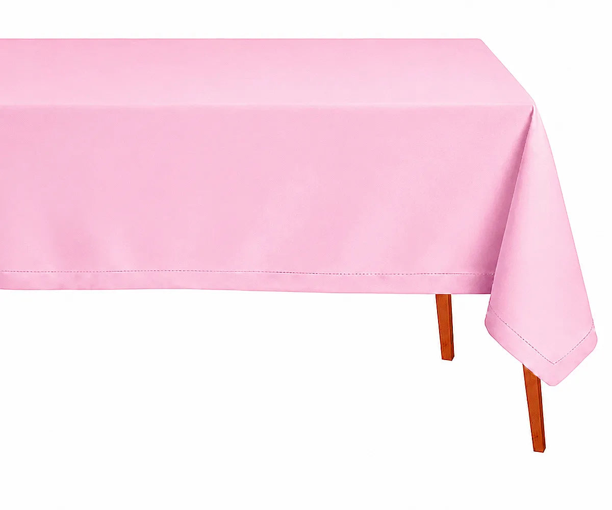 Soft pink rectangle linen tablecloth with elegant hemstitch border styled for romantic weddings, brunch tables, and modern dining spaces.