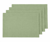 Sage green linen placemats on a dining table with elegant table décor, green placemats for dining table, linen table mats.