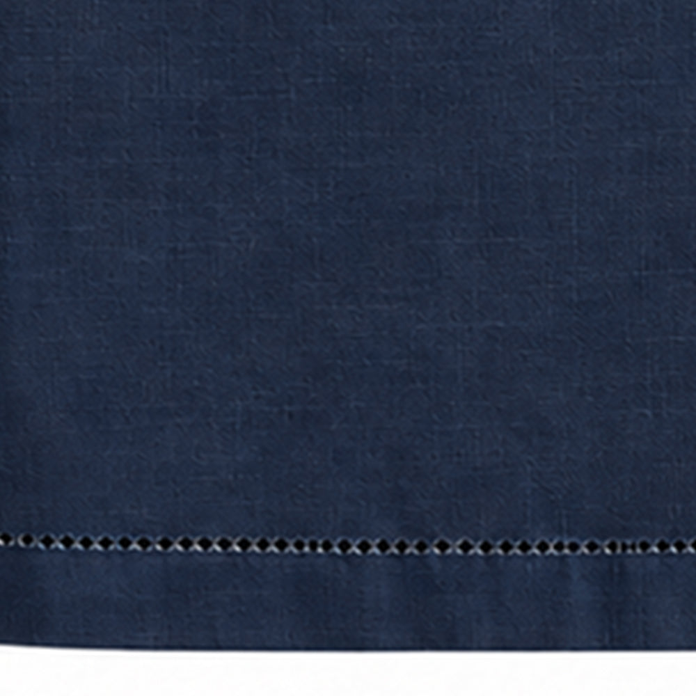 Close-up of navy blue cotton linen tablecloth with hemstitched border detail.