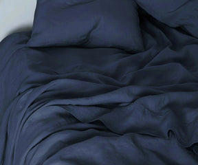 Navy linen bedding set with 100% linen sheets and duvet cover for a stylish contemporary bedroom. european linen bedding