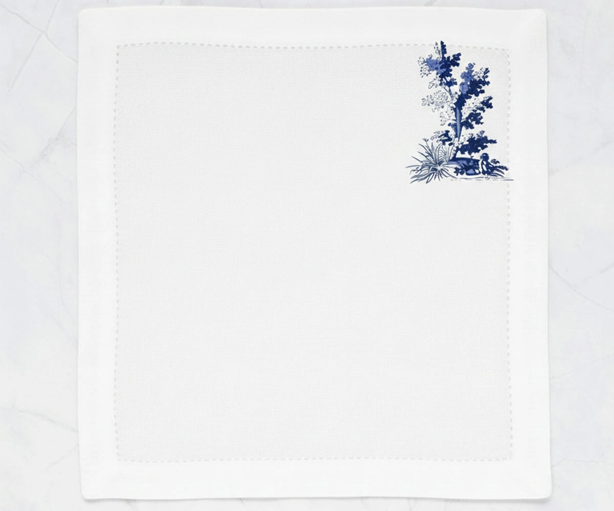white cotton napkins with blue toile print design, soft washable printed cloth napkins ideal for brunch tables, dinner parties, and farmhouse-inspired décor