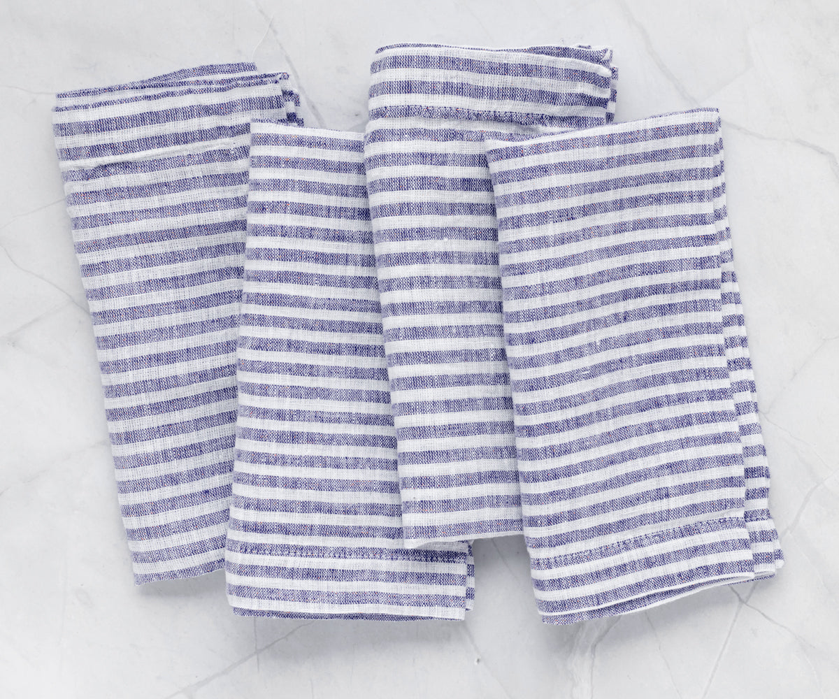Premium blue pinstripe linen napkins enhancing formal dinner tables with refined visual appeal
