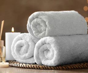Premium white cotton terry towel with thick absorbent loops, ideal for bathroom, spa, gym, beach, and travel use